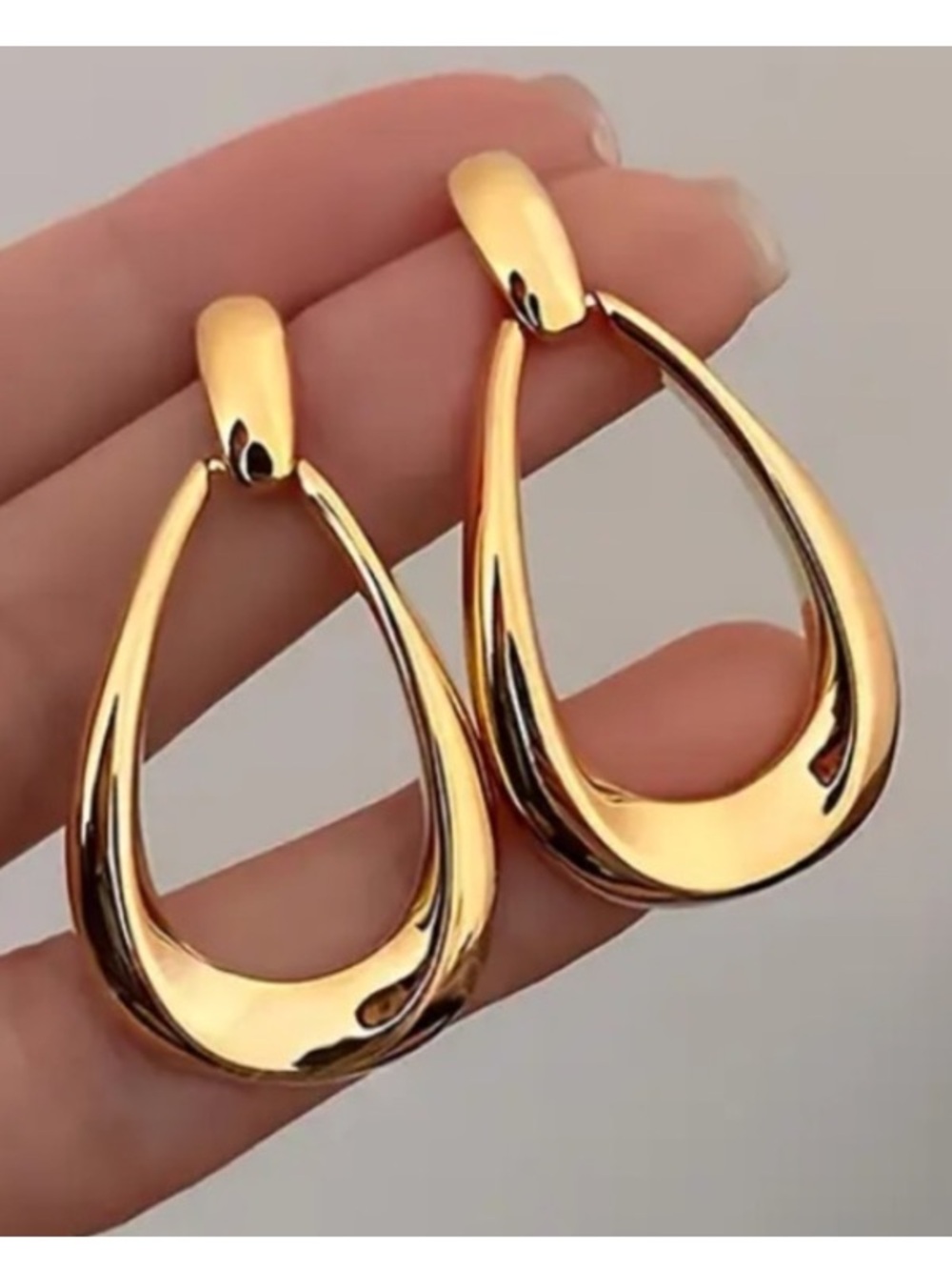 Sleek Teardrop Gold Toned Stud Earrings